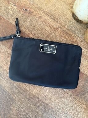 Kate Spade New York black wristlet double pouch with gold logo